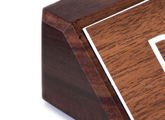 A plastic engraved nameplate is mounted elegantly onto a solid block of wood - order online.