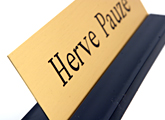 Your brass desk nameplates are held upright with the solid black nameplate base.